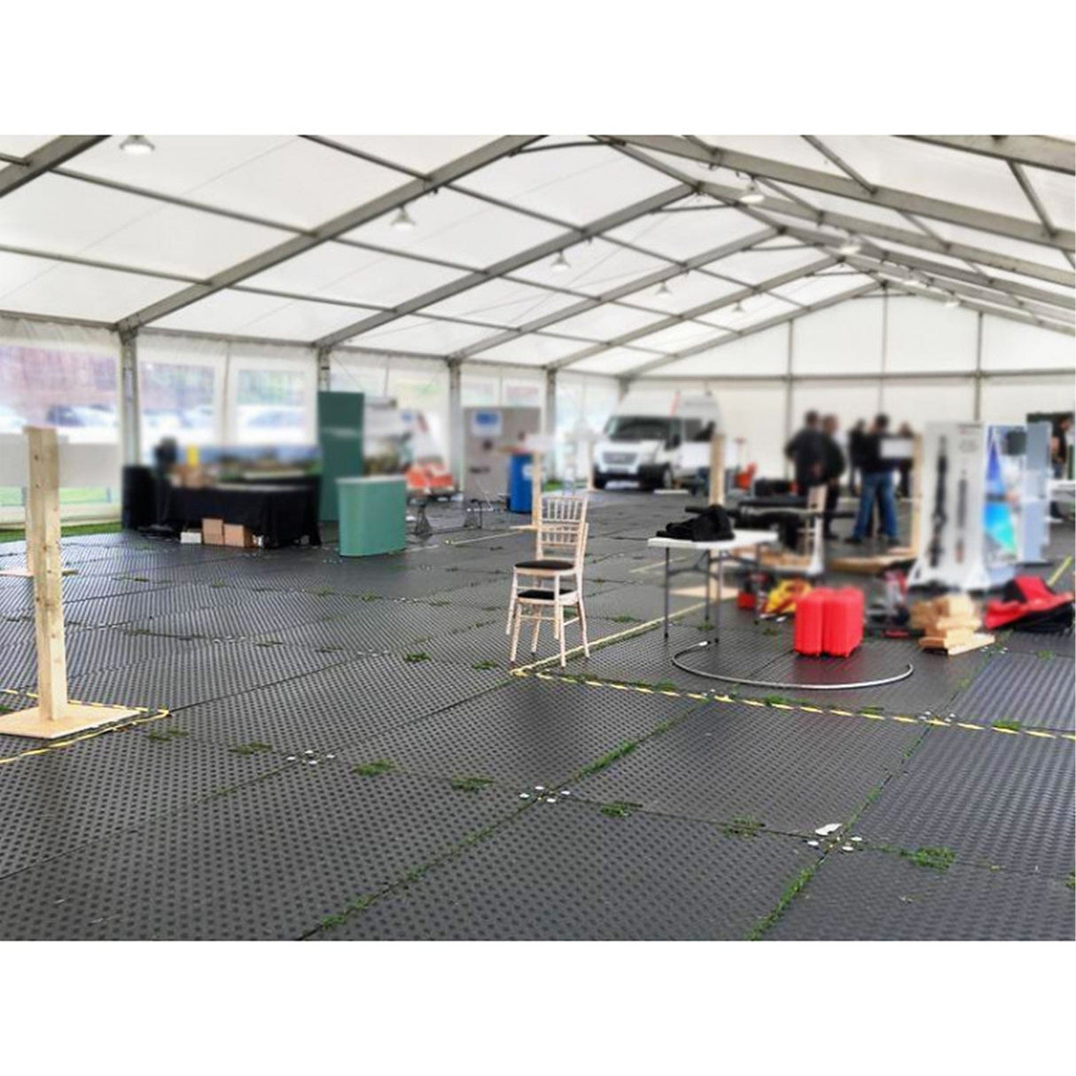 Modular interlocking floor tiles inside an event marquee