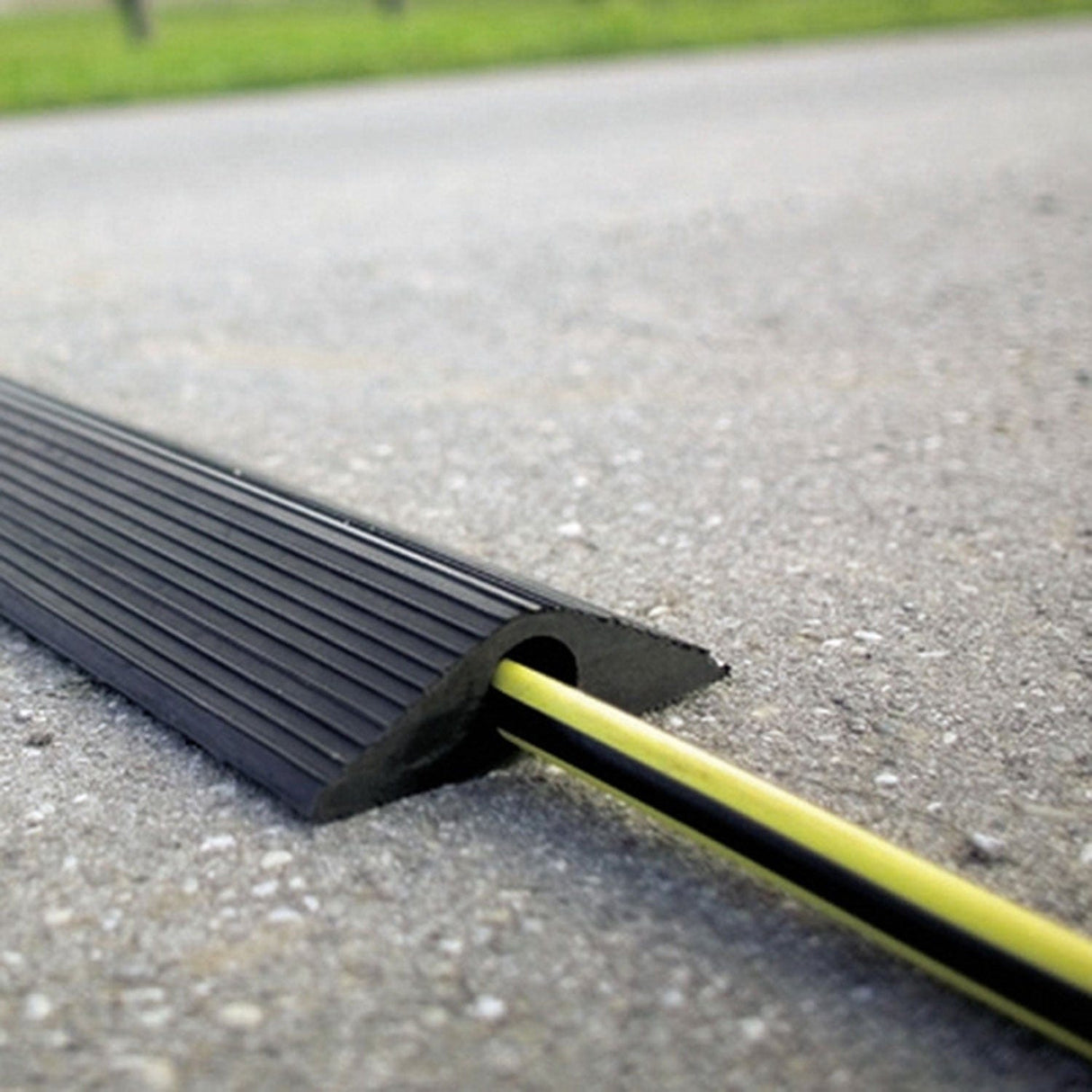 Hose-ramp-drive-over-1-channel-roll-out-10-metre-cable-protector-heavy-duty-vehicle-rubber-industrial-portable-cord-floor-wire-cover-management-hider-shield-outdoor-durable-compact-protection