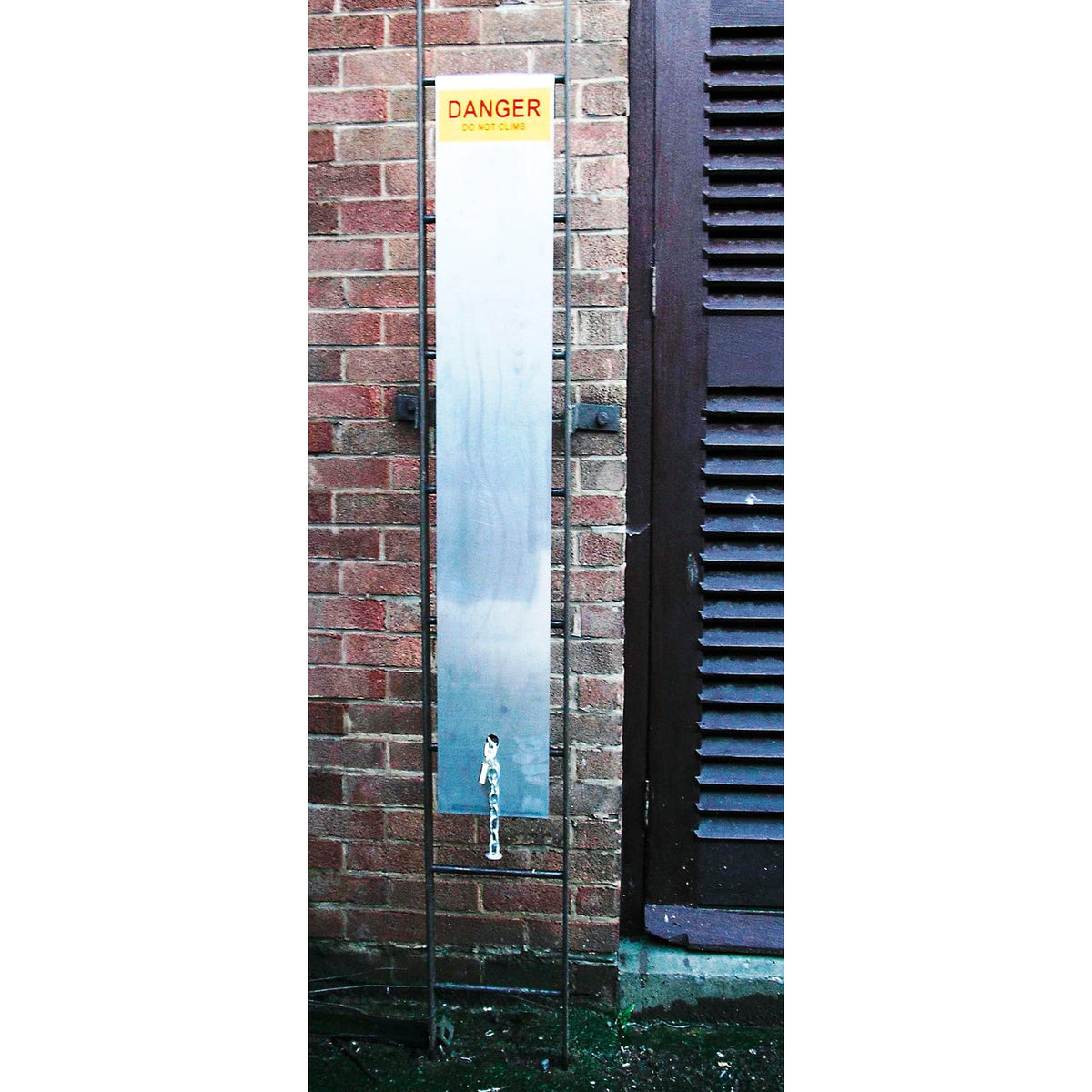 Ladder Sentry Climb Protection fitted to a straight ladder against a brick wall, DANGER DO NOT CLIMB label visible