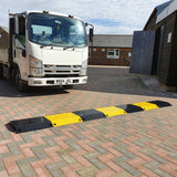titan-steel-speed-ramp-bump-black-yellow-parking-lot-traffic-control-industrial-hgv-vehicle-suitable-heavy-duty-robust-durable-modular-high-visibility-road-low-profile-welded-metal-hot-dip-galvanised-reusable-cable-hose-ramp-shopping-centres-railway-waste-centres-low-maintenance 