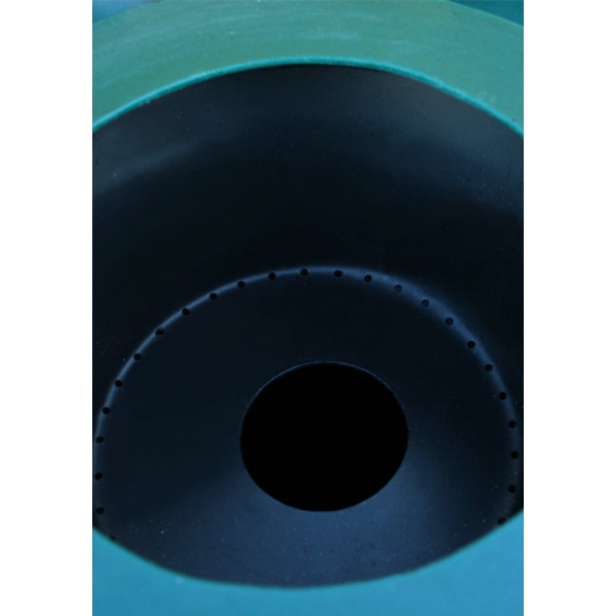 Close-up looking into the tank's access lid, showing the removable mesh filter and drain point