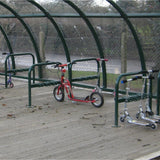 Double sided kids scooter rack offering secure storage for school playgrounds