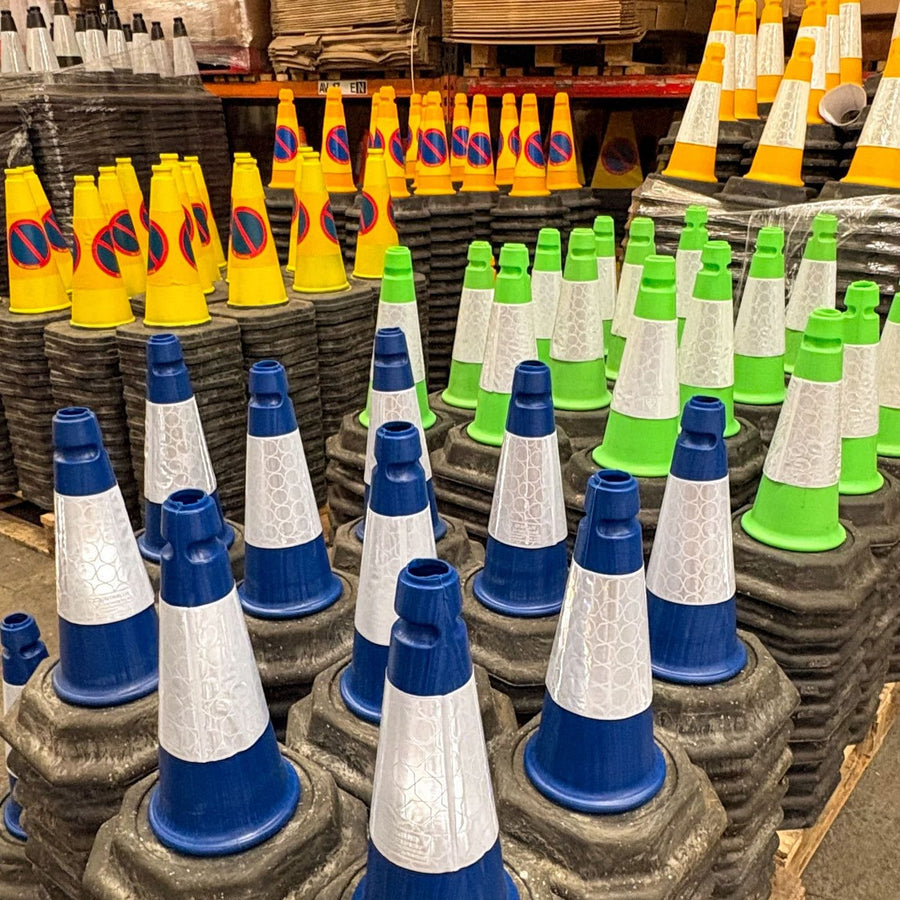 Traffic cones stacked on pallets in our warehouse