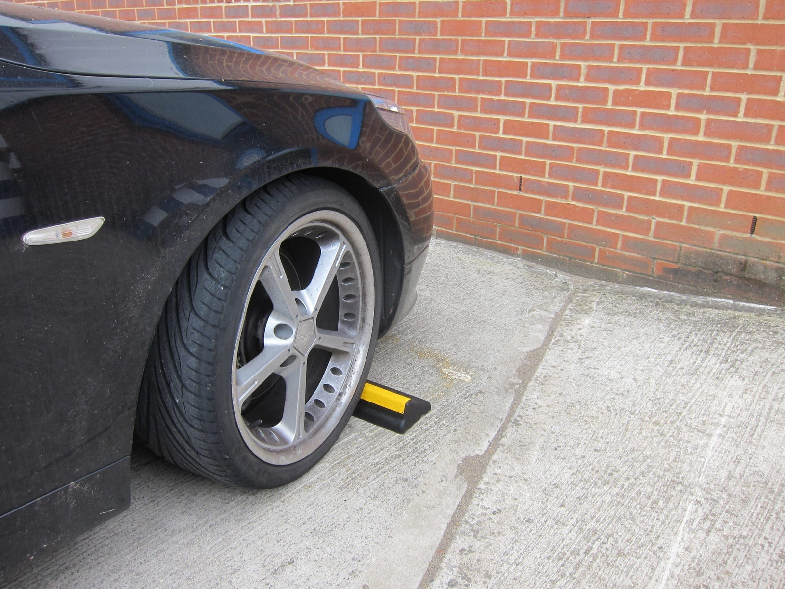 PVC car parking stops rubber parking stop wheel stoppers tyre car tyre UK chock blocks rubber wheel stops car stoppers for garage recycled parking blocks parking space HGV Truck parking stops Street Solutions UK