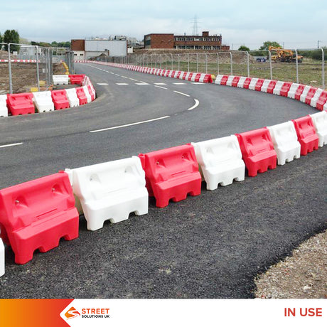 Construction site safety Water-filled barriers Hazard prevention Traffic management Road safety Temporary barriers Impact resistance Stability Visibility Safety standards Street Solutions UK