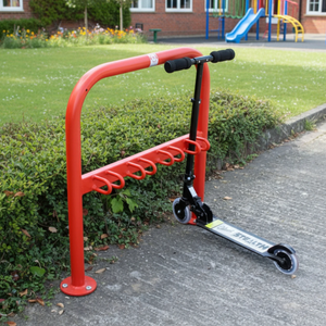 Red steel scooter stand in school playground