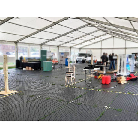 Modular interlocking floor tiles inside an event marquee