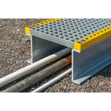 GRP-step-over-platform-glass-reinforced-plastic-walkway-access-industrial-site-safety-pipework-cables-high-visibility-free-standing-durable-lightweight-corrosion-resistant-fibreglass-warehouse-factory-flooring-construction-outdoor-indoor
