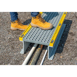 GRP-step-over-platform-glass-reinforced-plastic-walkway-access-industrial-site-safety-pipework-cables-high-visibility-free-standing-durable-lightweight-corrosion-resistant-fibreglass-warehouse-factory-flooring-construction-outdoor-indoor
