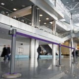 Skipper-TM-Q-retractable-barrier-queue-management-safety-barriers-airport-events-belt-tape-indoor-outdoor-post-base-purple-customisable-hospital-crowd-control-warehouse-banks-hotels-resteraunts-retraction-recycled-recyclable