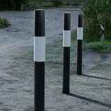 black-white-round-fixed-bollard-crash-impact-high-anti-ram-vehicle-safety-perimeter-security-crash-tested-heavy-duty-outdoor-street-furniture-pedestrian-modern-urban-public-space-carpark-building-protection-commercial-industrial