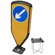 3SIXTY self-righting bollard, black frame with blue keep-left diagonal arrow face, shown with the foundation cage and gro