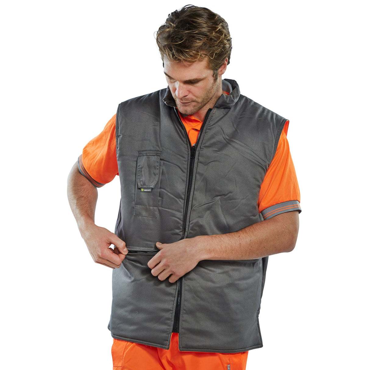Boost your visibility with our Reversible Hi-vis Interactive Bodywarmer in striking Orange/Grey.
