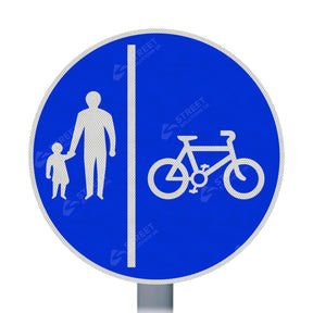957v cycle and pedestrian route sign face on a post, blue circle with pedestrian and cyclist symbols split by a white line