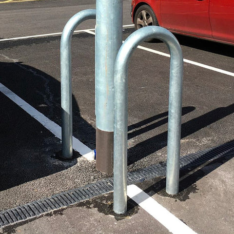 Lamp post protector, street furniture guard, bollard cover for parking lot and traffic safety. Collision protective sleeve for vehicle damage prevention and street lighting.